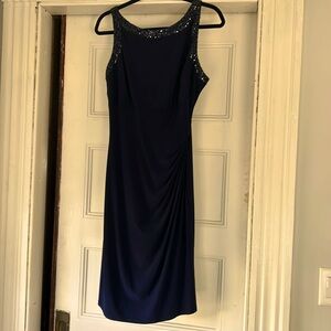 Navy blue , sleeveless shift style dress. Sequined around neck and sleeve.